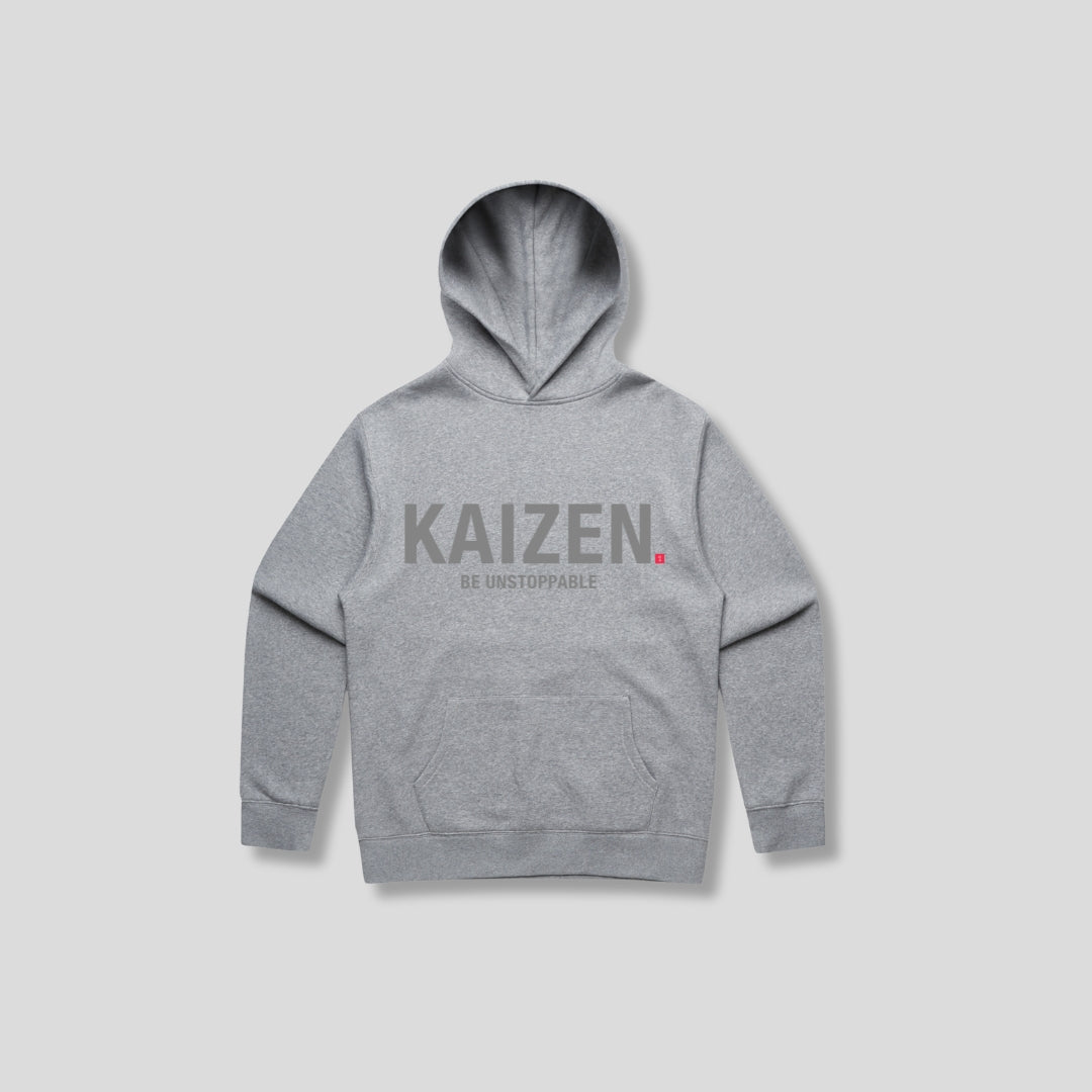 Grey hoodie with 'KAIZEN' text, folded flat on grey background