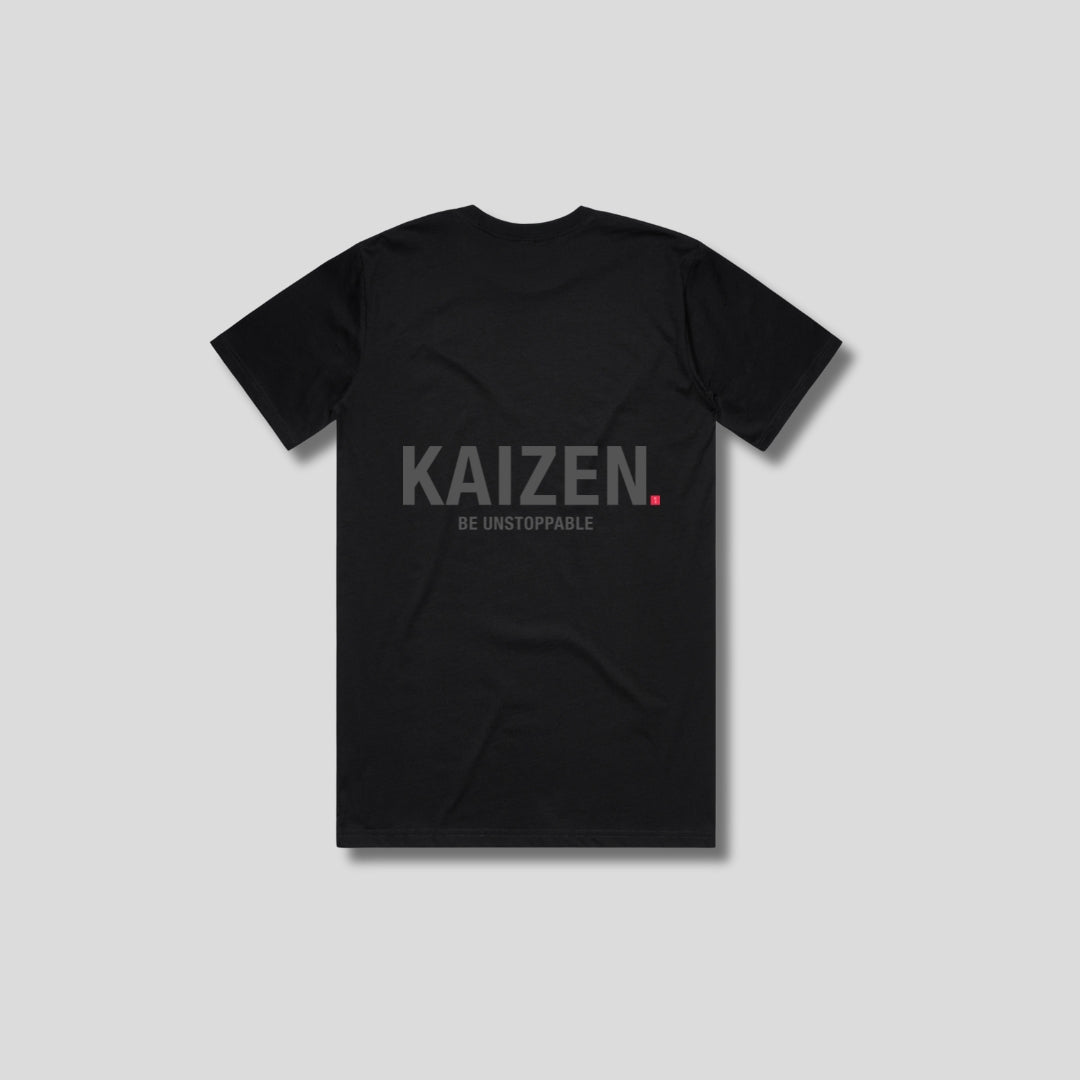 Black t-shirt with 'KAIZEN' logo, flat lay on neutral background