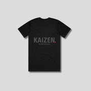 Black t-shirt with 'KAIZEN' logo, flat lay on neutral background