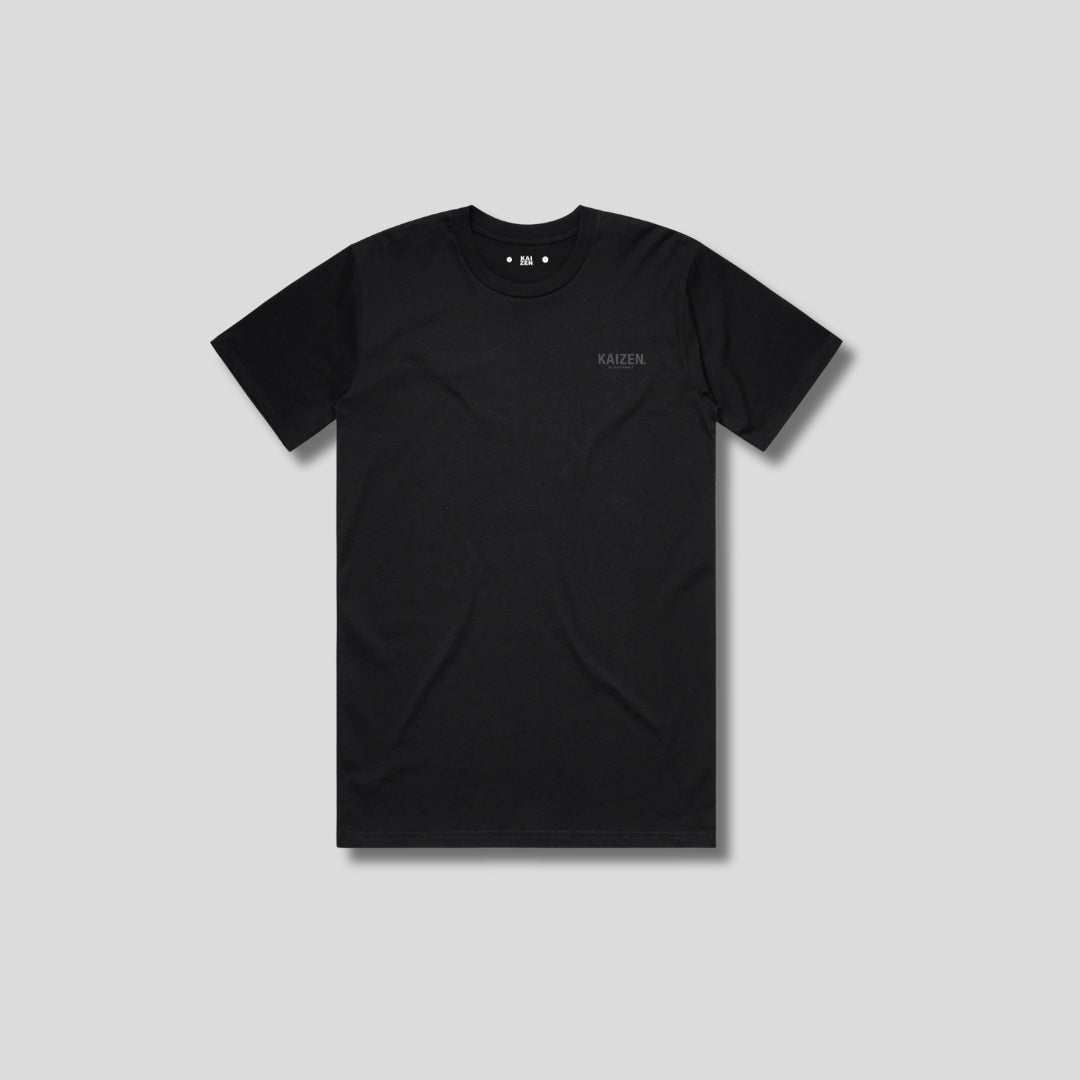 Black t-shirt with 'KAIZEN' logo, flat lay on neutral background