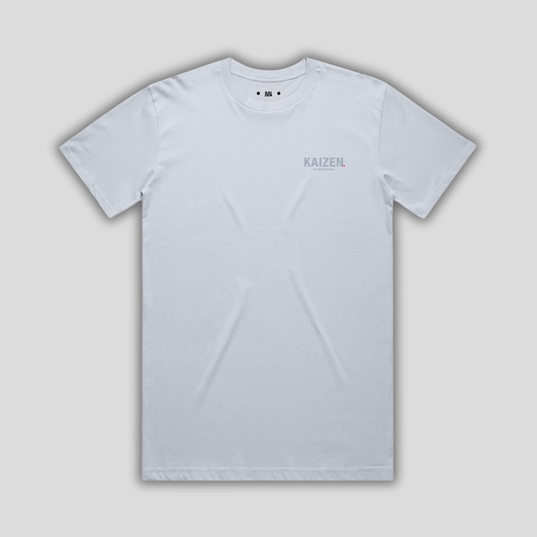 Blue t-shirt with 'KAIZEN' logo, flat lay on neutral background