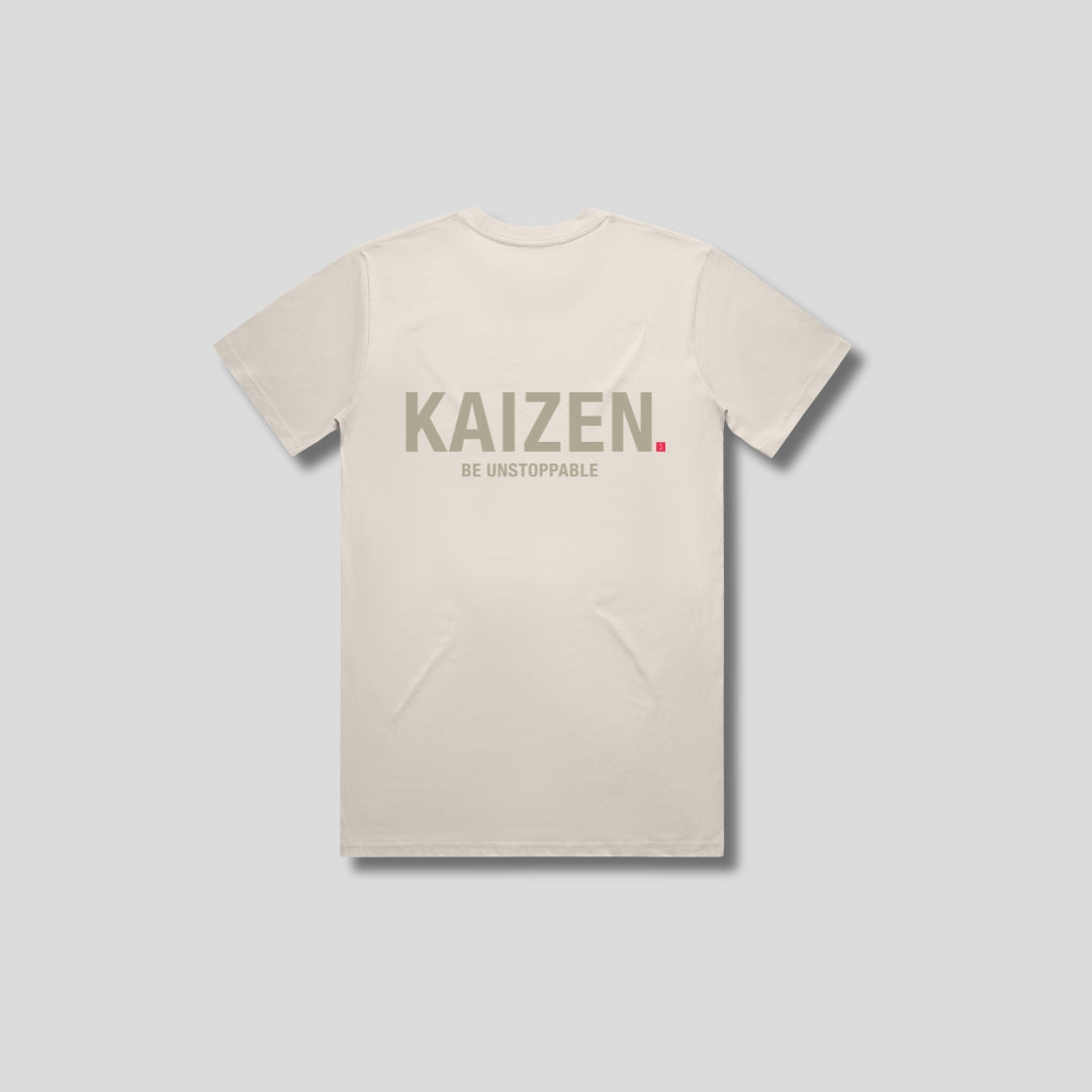 Bone t-shirt with 'KAIZEN' logo, flat lay on neutral background