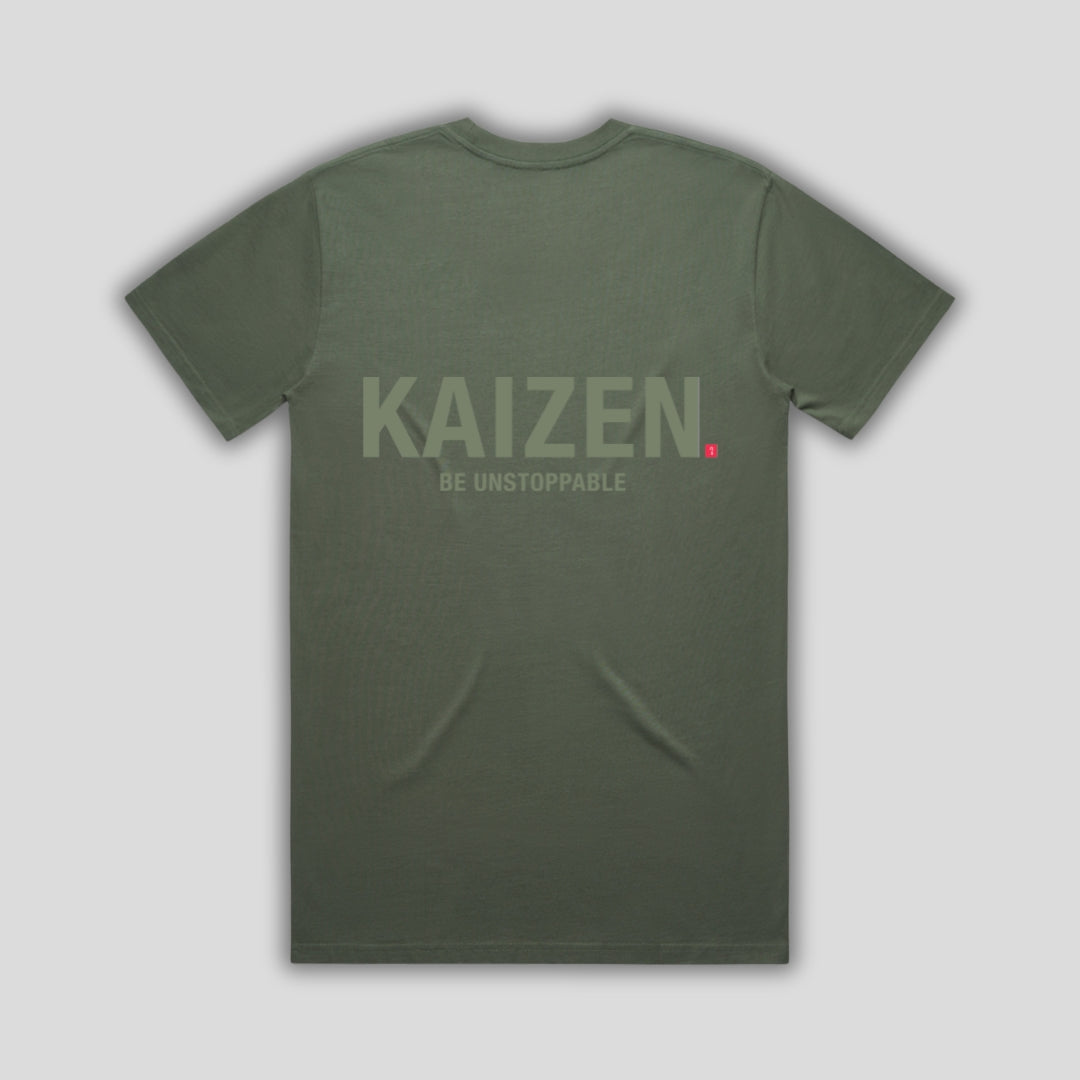 Green t-shirt with 'KAIZEN' logo, flat lay on neutral background