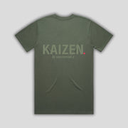 Green t-shirt with 'KAIZEN' logo, flat lay on neutral background