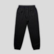 Black joggers with 'KAIZEN' logo, flat lay product image