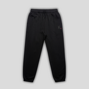 Black joggers with 'KAIZEN' logo, flat lay product image