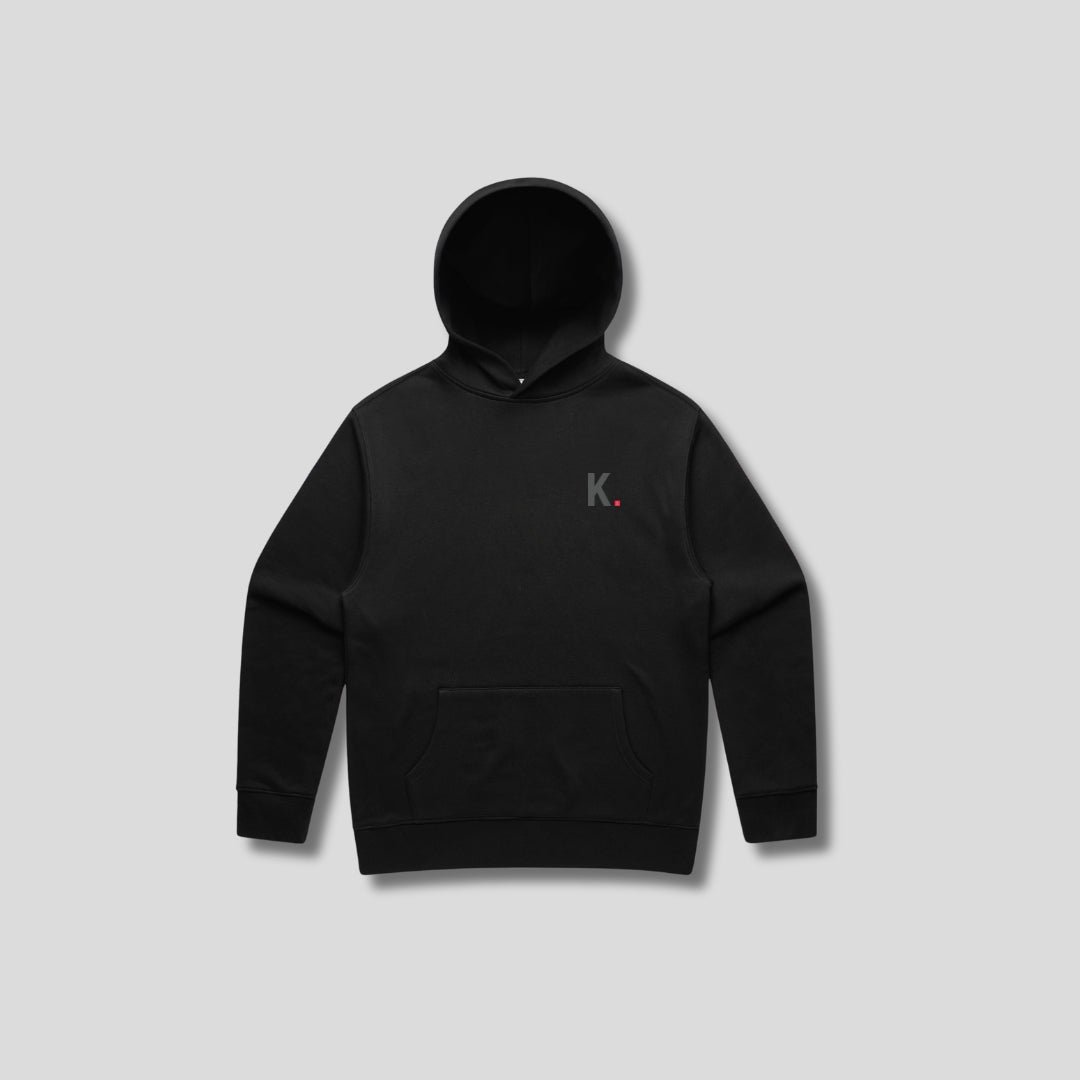 Black hoodie with 'KAIZEN' text, folded flat on grey background