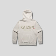 Bone hoodie with 'KAIZEN' text, folded flat on grey background