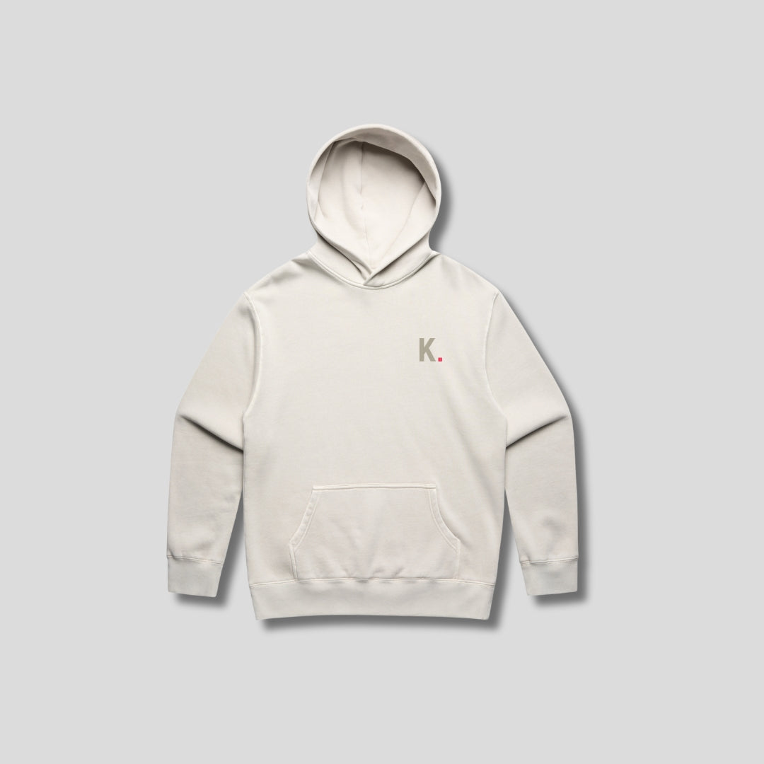 Bone hoodie with 'KAIZEN' text, folded flat on grey background