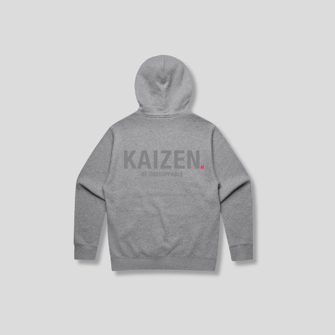 Grey hoodie with 'KAIZEN' text, folded flat on grey background