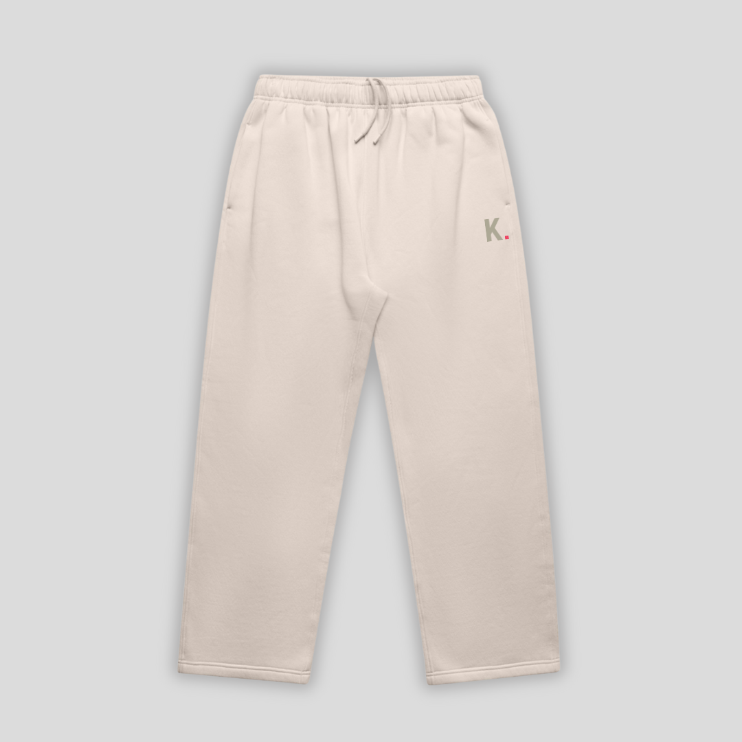 Bone straight leg joggers with 'KAIZEN' logo, flat lay product image