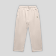 Bone straight leg joggers with 'KAIZEN' logo, flat lay product image