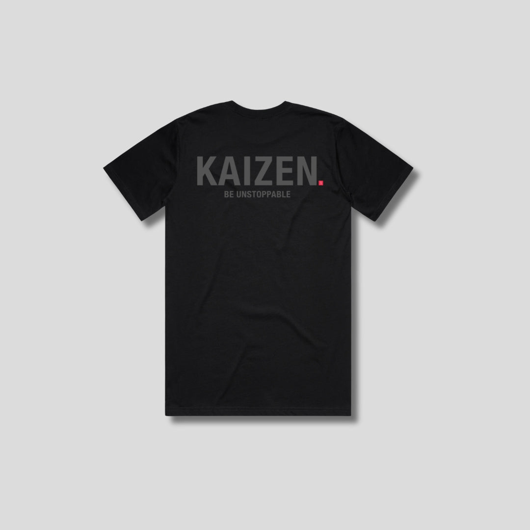 Black t-shirt with 'KAIZEN' logo, flat lay on neutral background