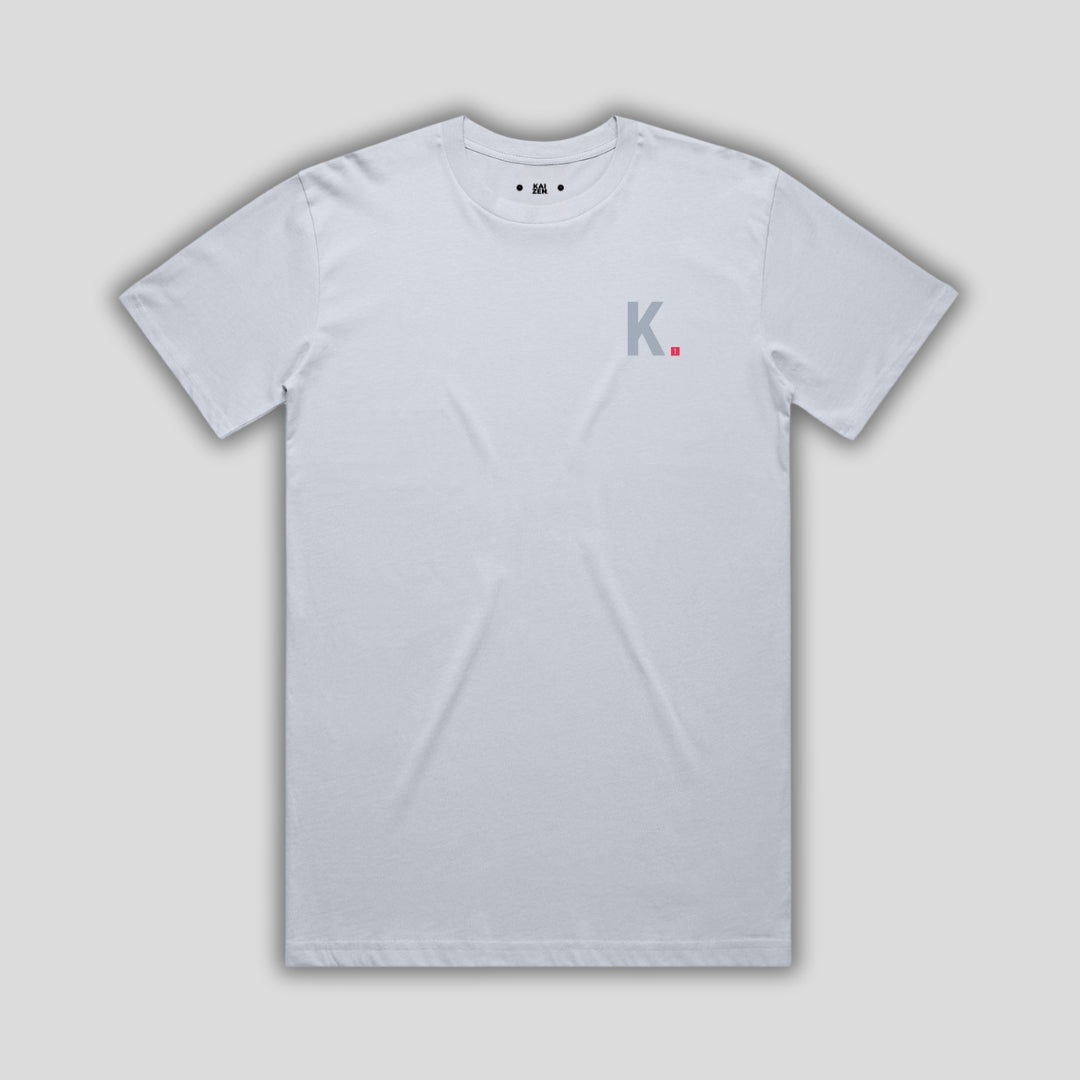 Blue t-shirt with 'KAIZEN' logo, flat lay on neutral background