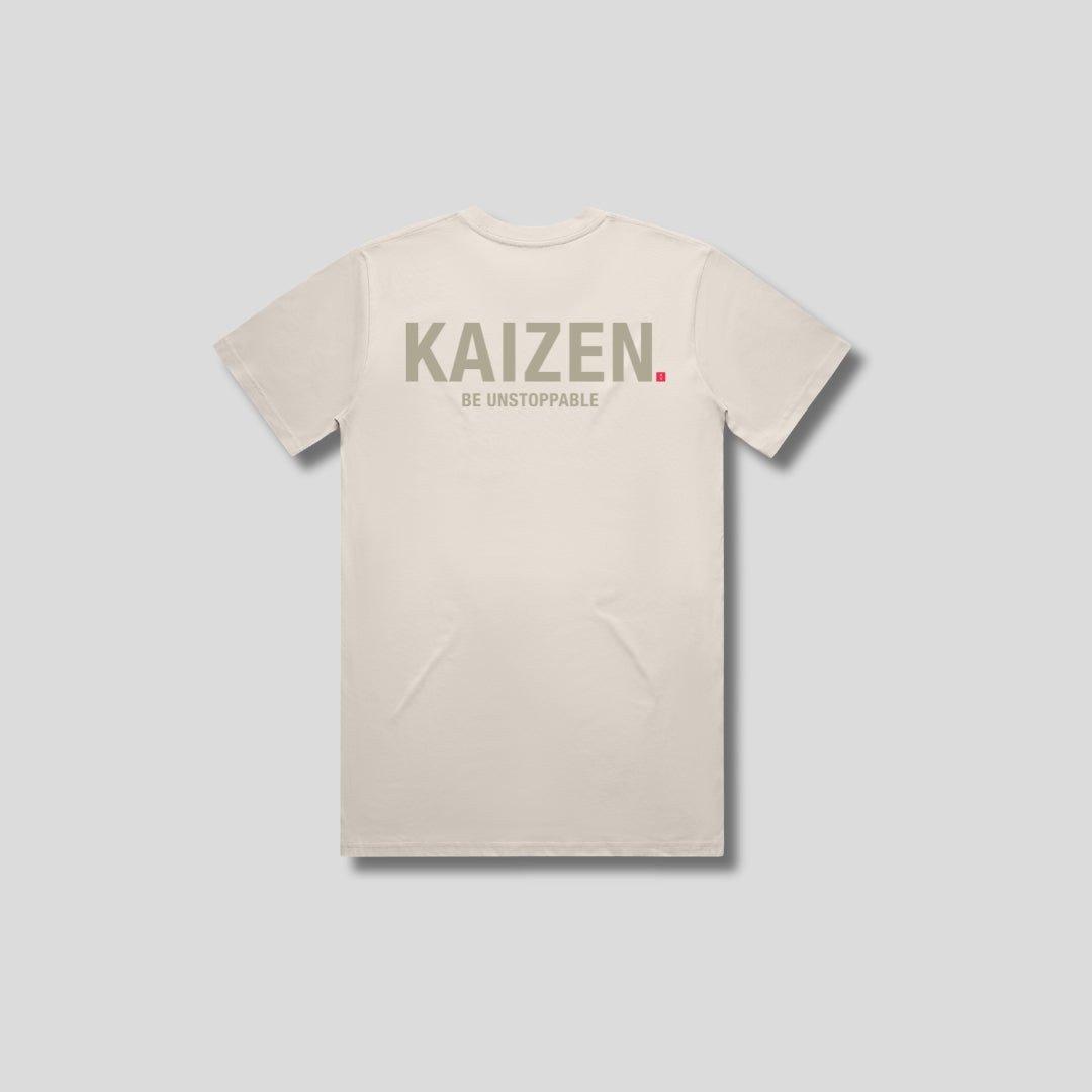 Bone t-shirt with 'KAIZEN' logo, flat lay on neutral background