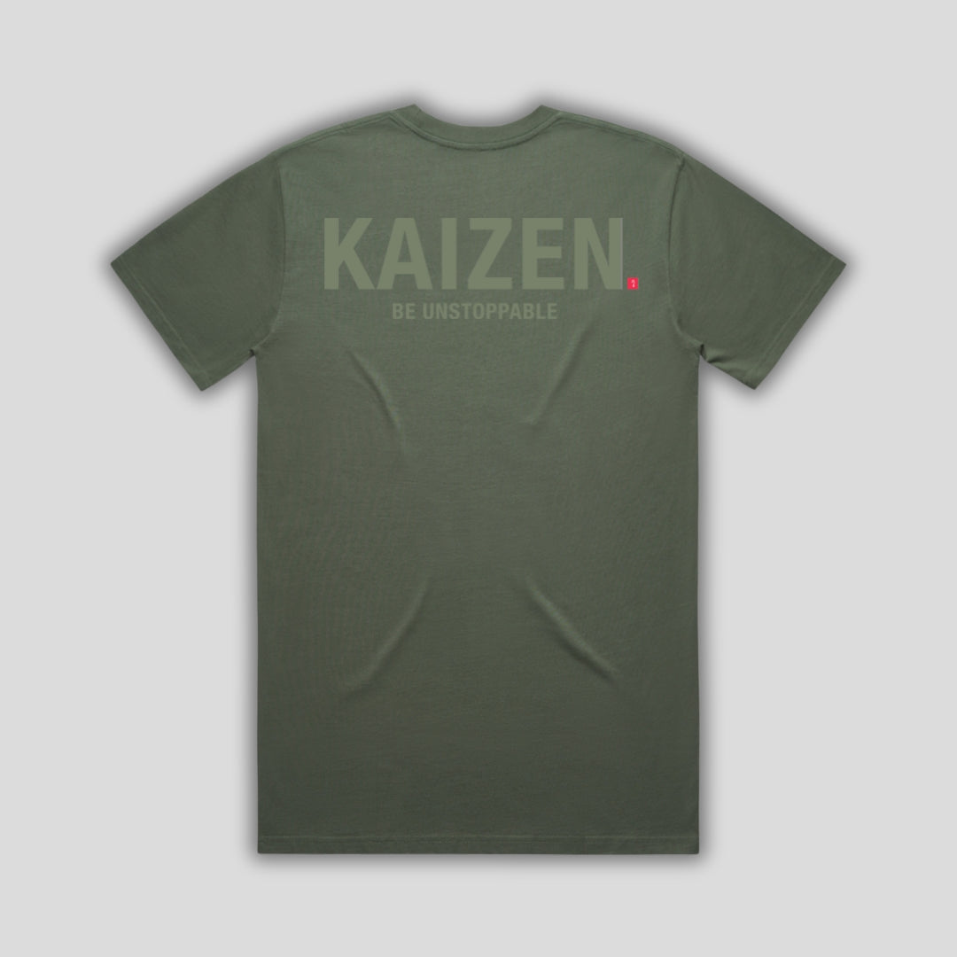 Green t-shirt with 'KAIZEN' logo, flat lay on neutral background