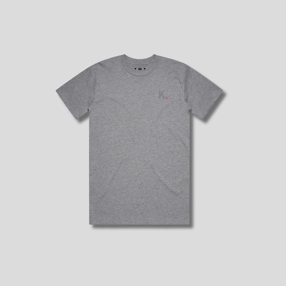 Grey t-shirt with 'KAIZEN' logo, flat lay on neutral background
