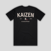 Black t-shirt with 'KAIZEN' logo, flat lay on neutral background