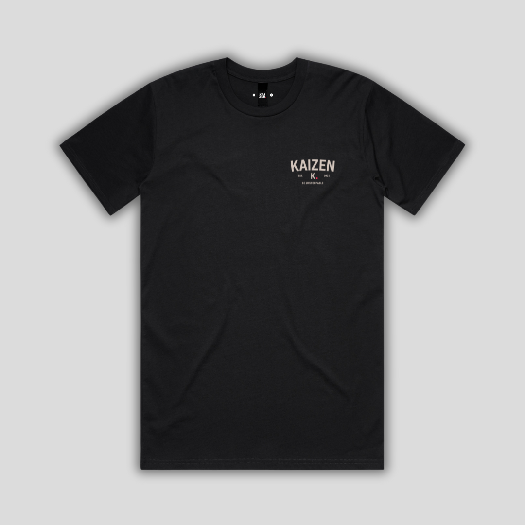 Black t-shirt with 'KAIZEN' logo, flat lay on neutral background