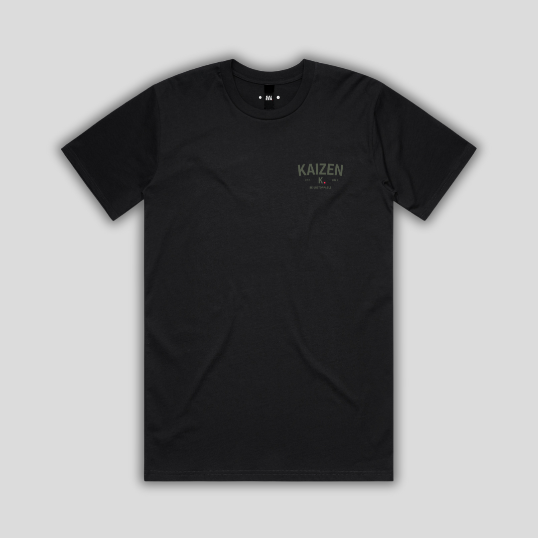 Black t-shirt with 'KAIZEN' logo, flat lay on neutral background