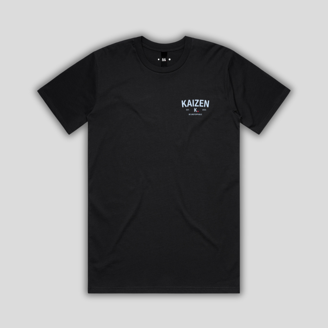 Black t-shirt with 'KAIZEN' logo, flat lay on neutral background