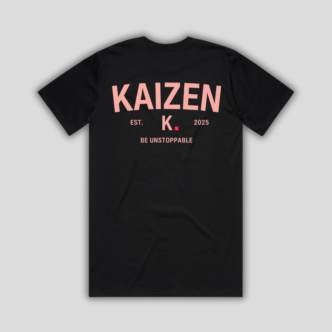 Black t-shirt with 'KAIZEN' logo, flat lay on neutral background