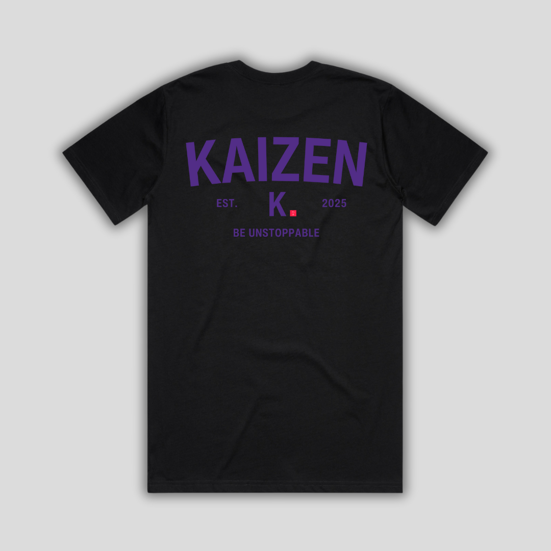 Black t-shirt with 'KAIZEN' logo, flat lay on neutral background