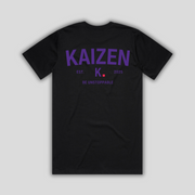 Black t-shirt with 'KAIZEN' logo, flat lay on neutral background