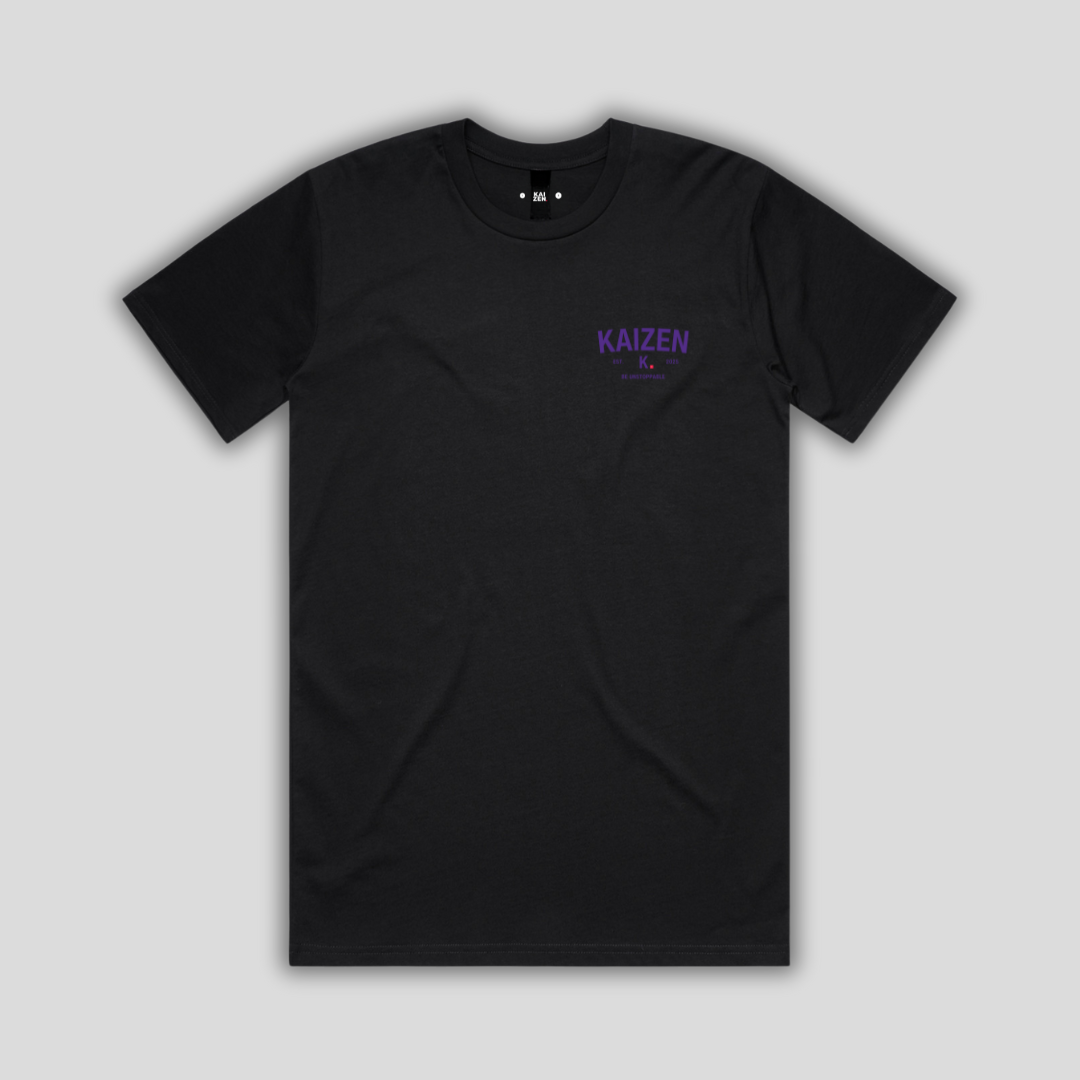 Black t-shirt with 'KAIZEN' logo, flat lay on neutral background