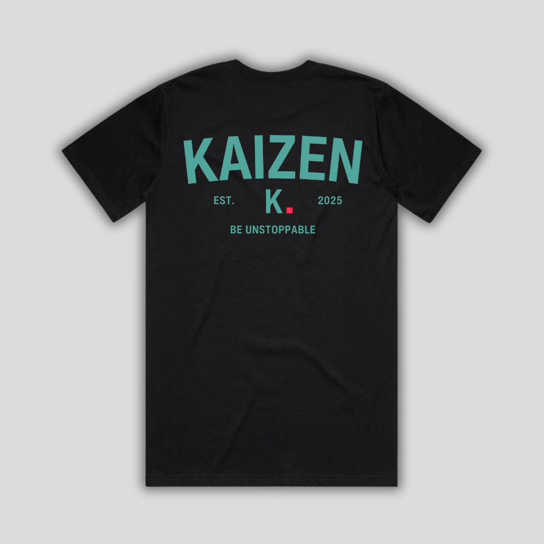 Black t-shirt with 'KAIZEN' logo, flat lay on neutral background