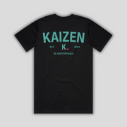 Black t-shirt with 'KAIZEN' logo, flat lay on neutral background