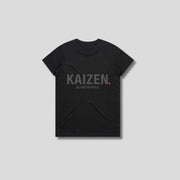 Black t-shirt with 'KAIZEN' logo, flat lay on neutral background
