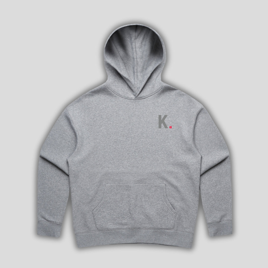 Grey hoodie with 'KAIZEN' text, folded flat on grey background