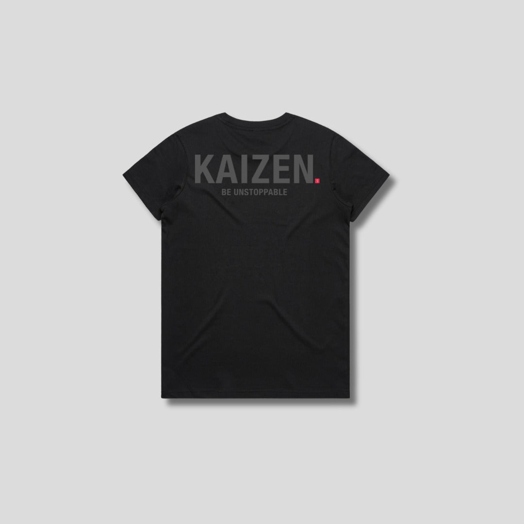 Black t-shirt with 'KAIZEN' logo, flat lay on neutral background