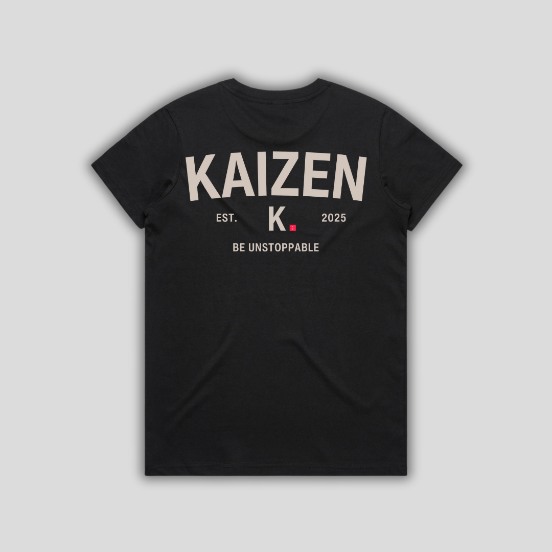 Black t-shirt with 'KAIZEN' logo, flat lay on neutral background