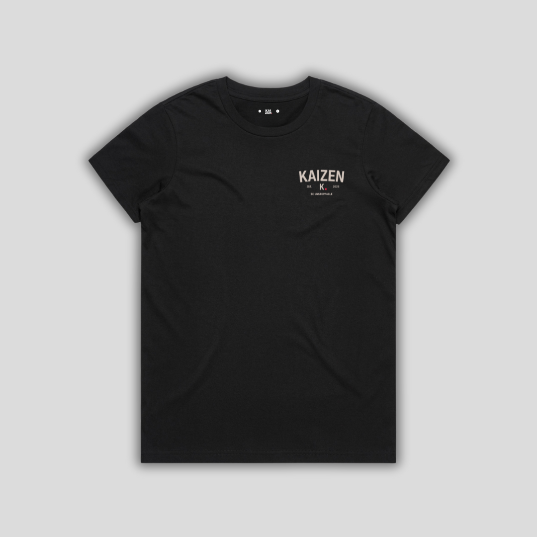 Black t-shirt with 'KAIZEN' logo, flat lay on neutral background