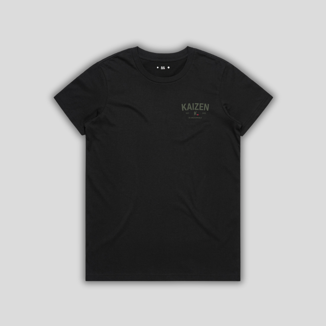 Black t-shirt with 'KAIZEN' logo, flat lay on neutral background
