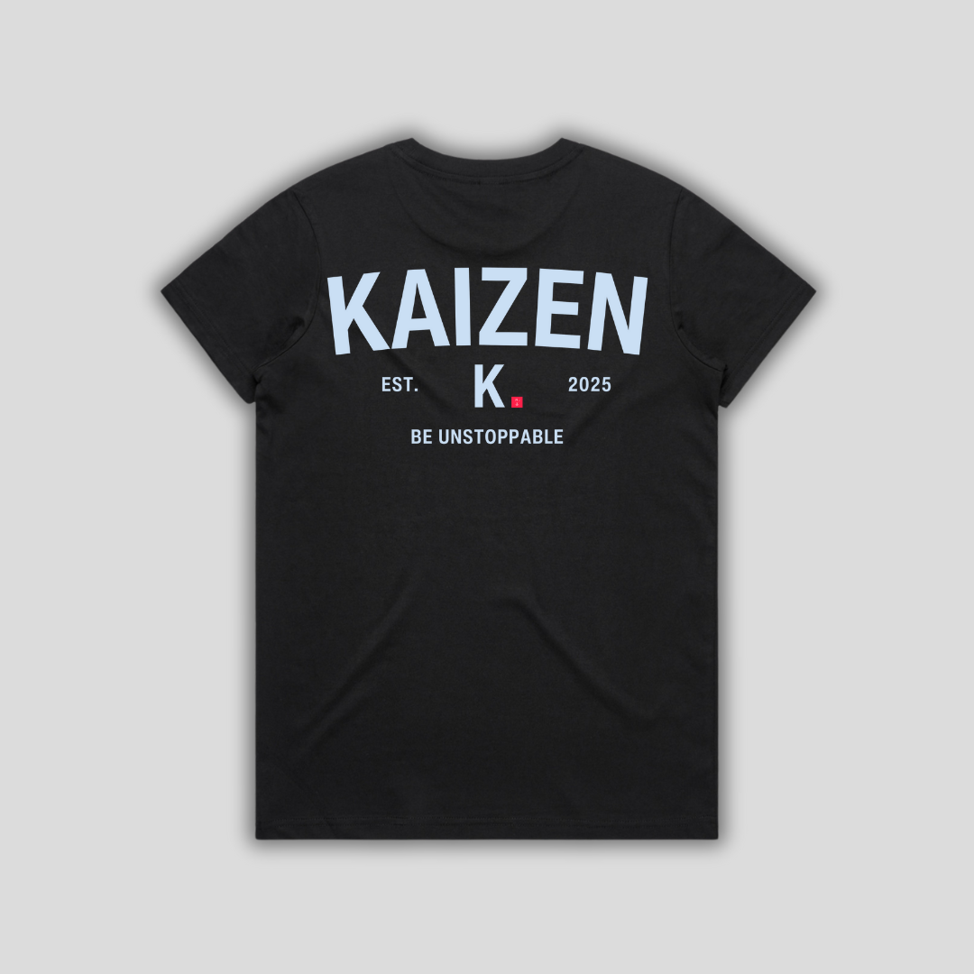 Black t-shirt with 'KAIZEN' logo, flat lay on neutral background