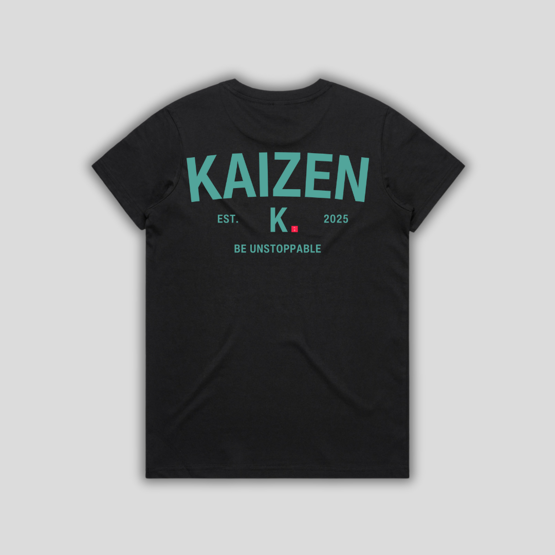 Black t-shirt with 'KAIZEN' logo, flat lay on neutral background