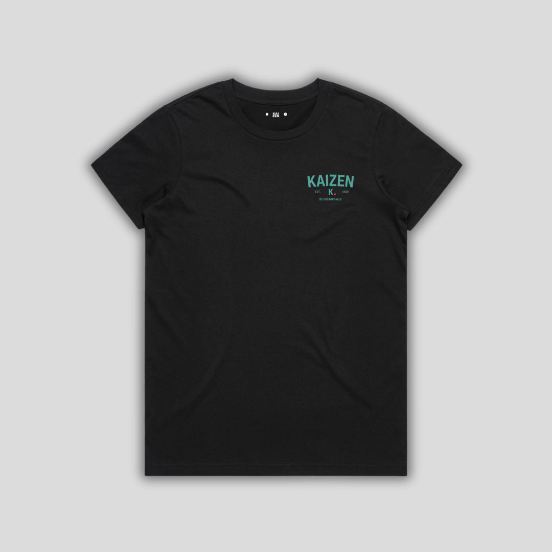 Black t-shirt with 'KAIZEN' logo, flat lay on neutral background