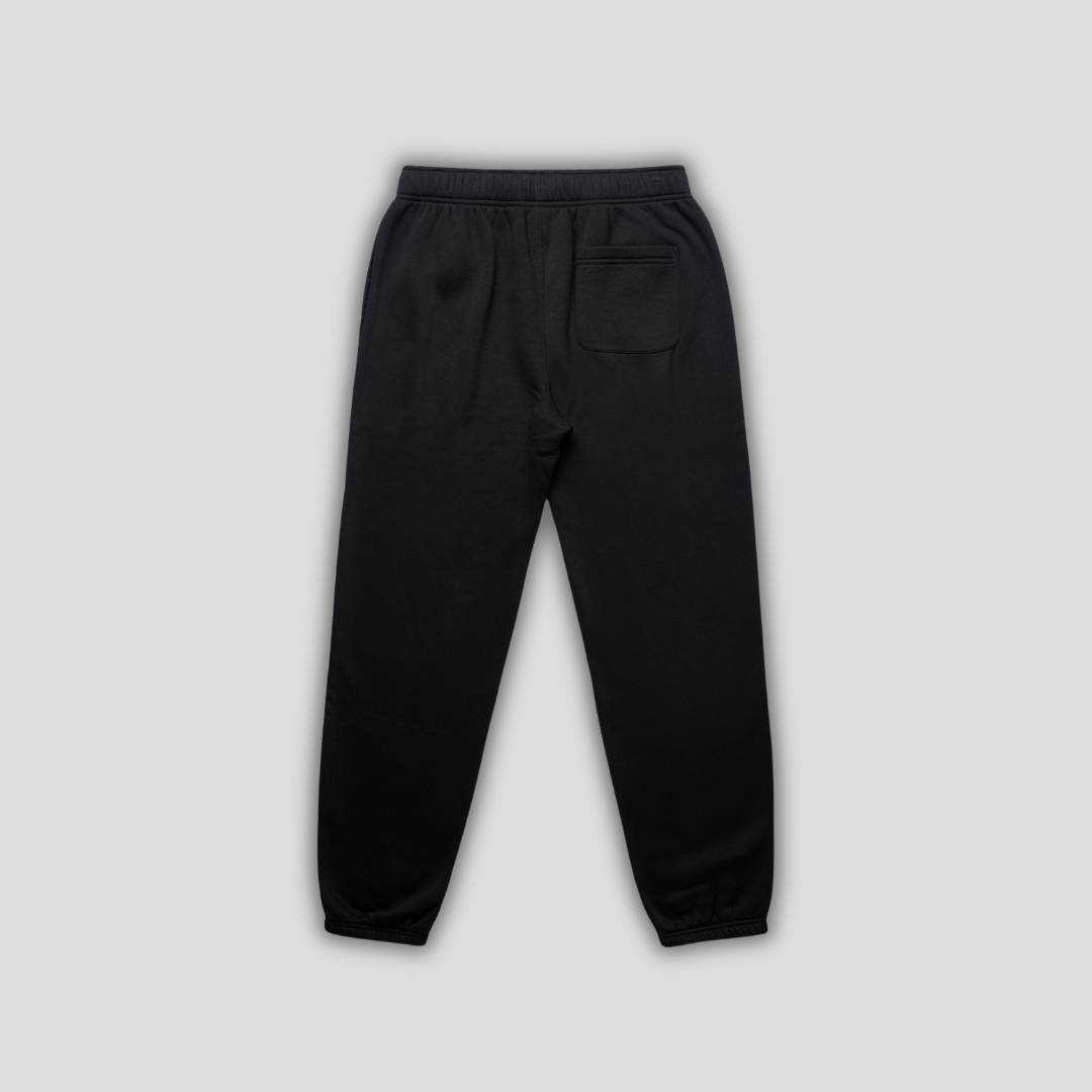 Black joggers with 'KAIZEN' logo, flat lay product image